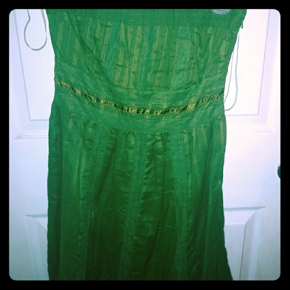 Green strapless dress with lace detail.